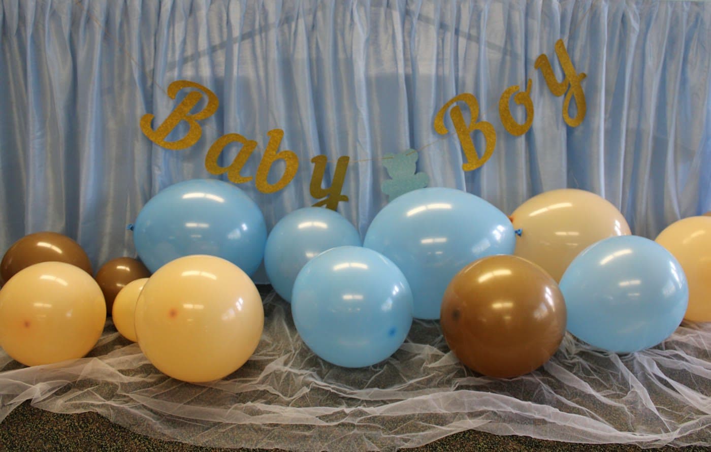 Blue and gold balloons with a Baby Boy sign