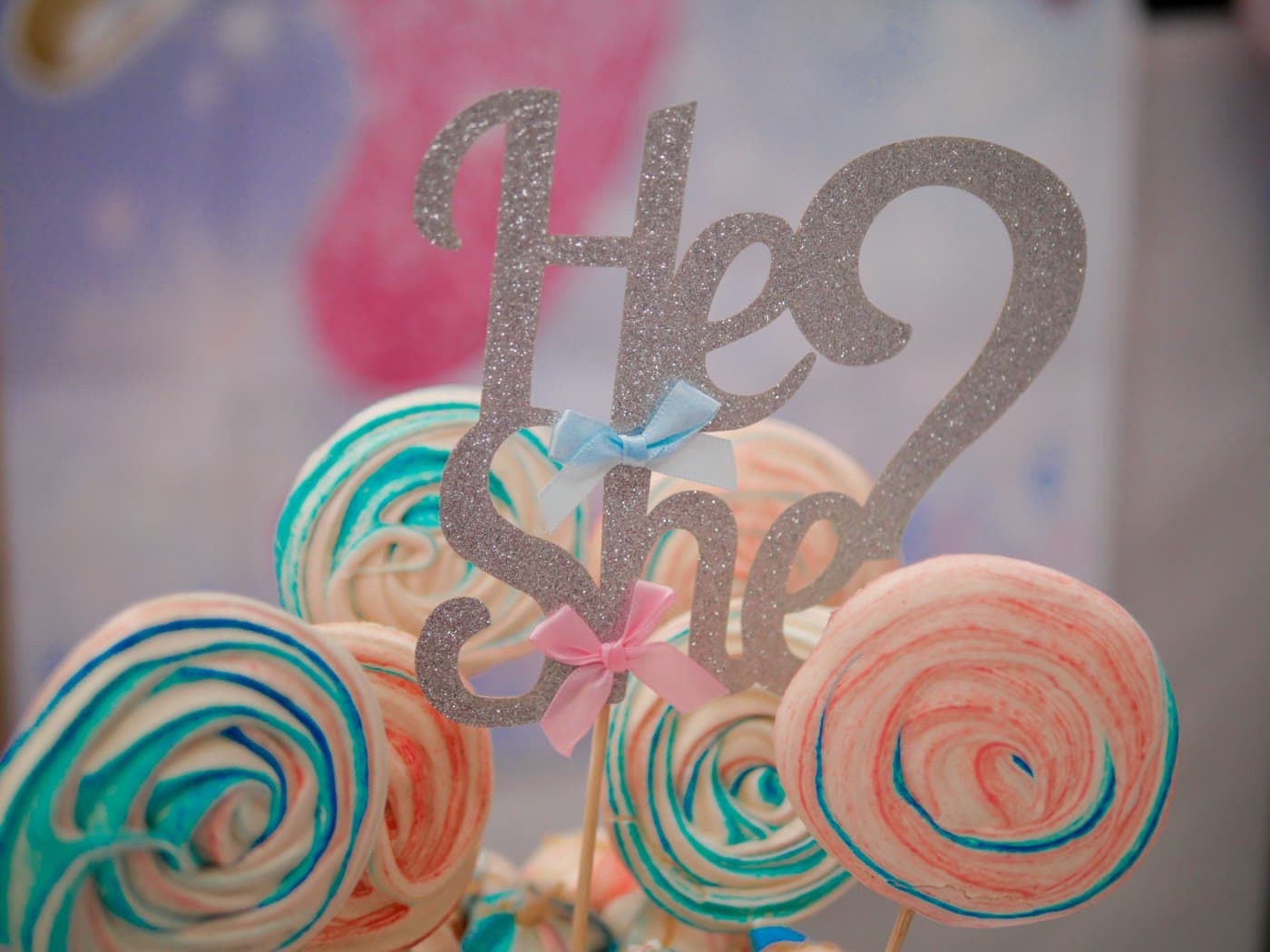Colourful lollipops with a he or she topper