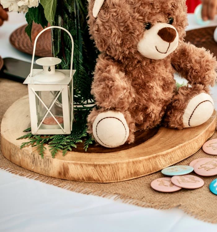 Teddy bear and lantern on a decorated table